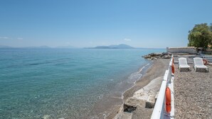 A clear view of a pebble beach with a lifebuoy, a lifebuoy, and a lifebuoy. - Peloponnese Beachfront Villa (Gelinas Beach house) (Paralia)