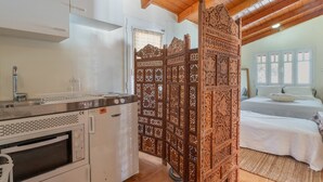 A kitchen with a built-in oven, a refrigerator, and a sink. - Peloponnese Beachfront Villa (Gelinas Beach house) (Paralia)