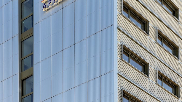 A modern building with a sign for Montempo Apparithotel.