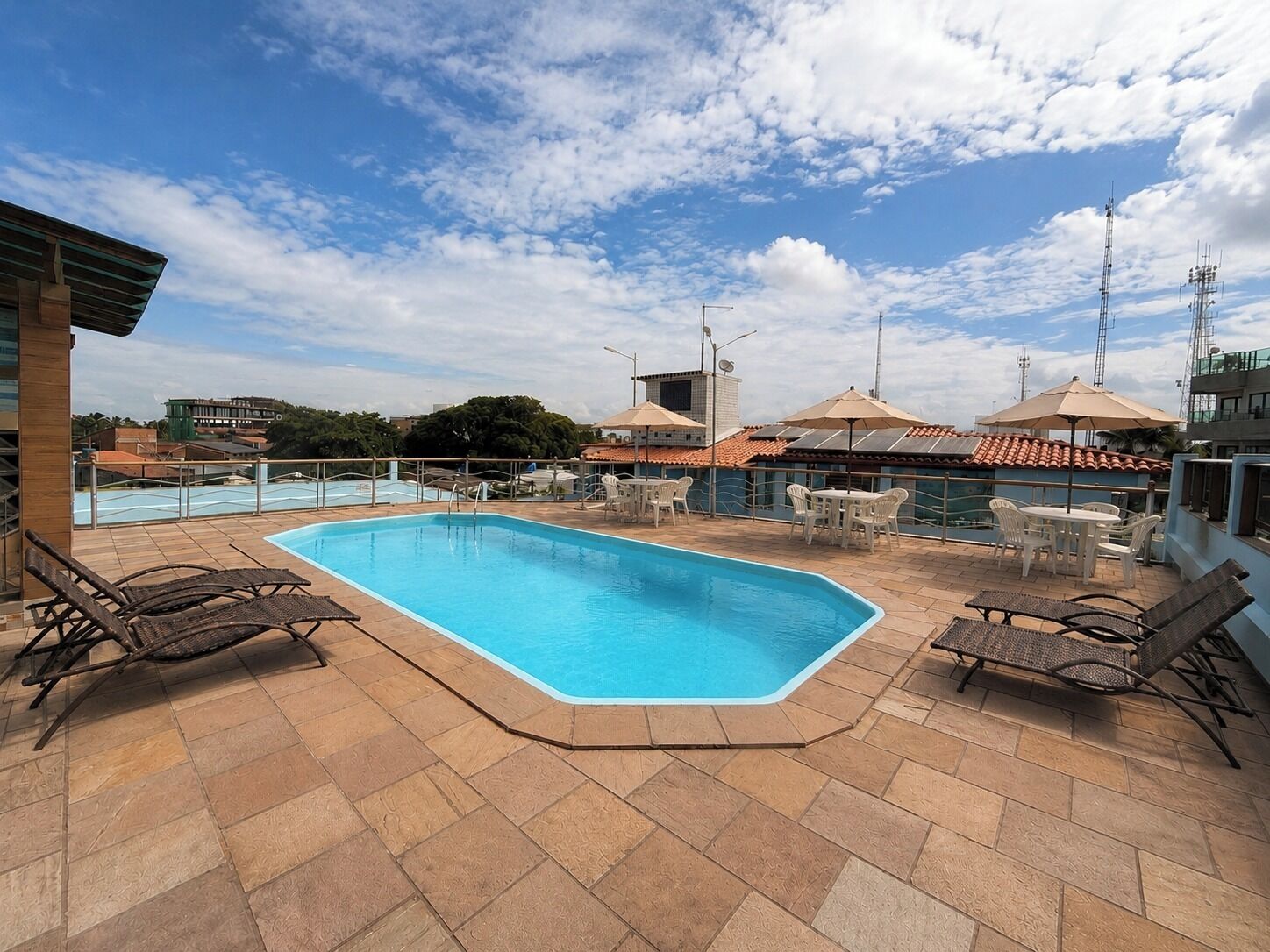 Outdoor pool, open 8:00 AM to 6:00 PM, pool umbrellas, pool loungers