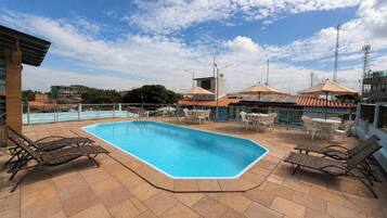 Outdoor pool, open 8:00 AM to 6:00 PM, pool umbrellas, pool loungers