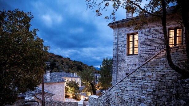 A stone building with a staircase, a window, and a tree. - Monopatia Resort (Zagori)