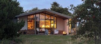 Summer house with fields and fjord views