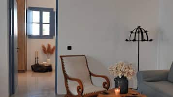 Deluxe Suite, Balcony, Sea View | Living area | 50-inch Smart TV with cable channels
