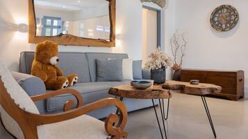 Deluxe Suite, Balcony, Sea View | Living area | 50-inch Smart TV with cable channels