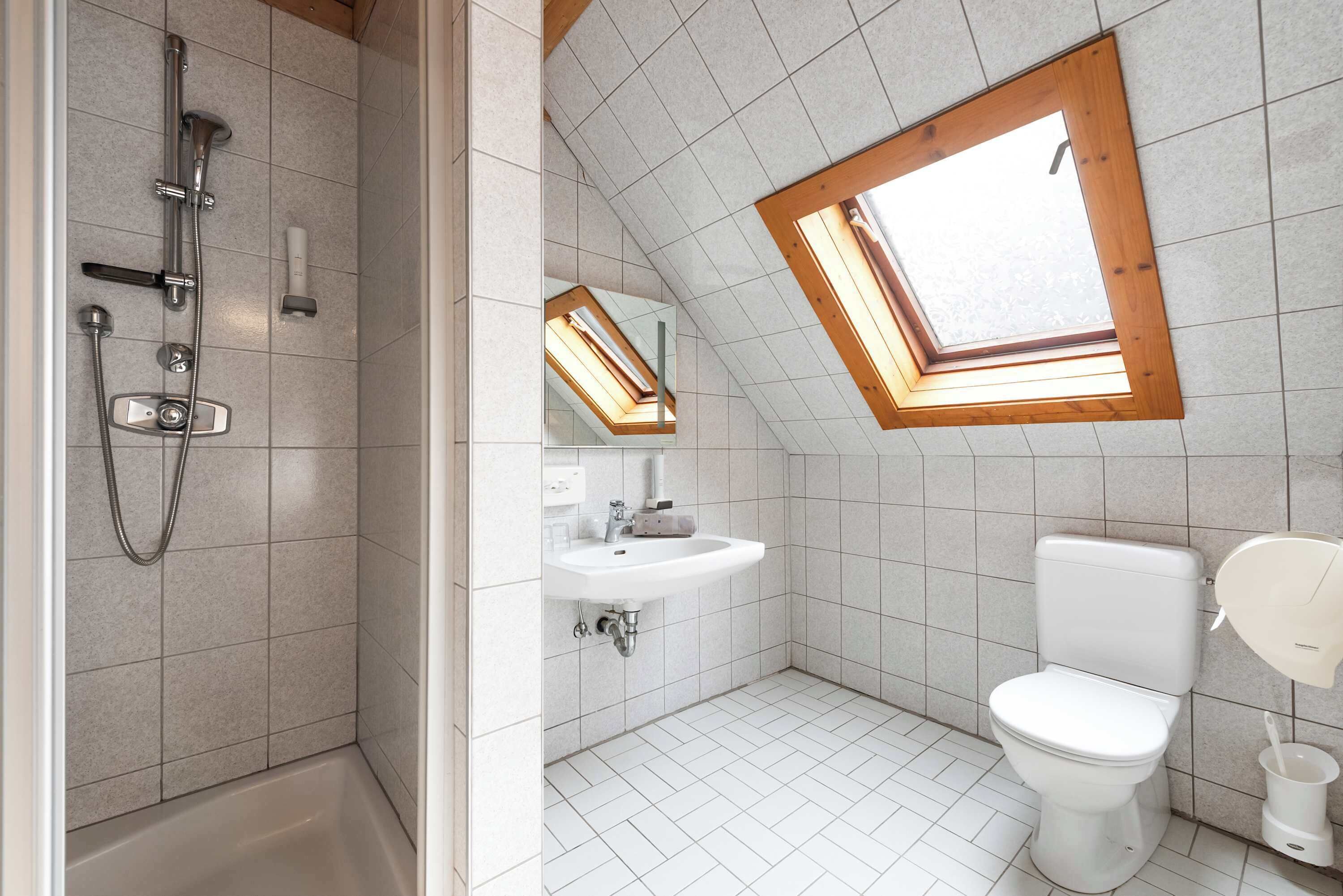 Shower, hair dryer, towels, shampoo