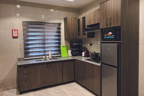 Family Apartment, Balcony, City View | Private kitchen - Macdestly Apartment (Gwarinpa)
