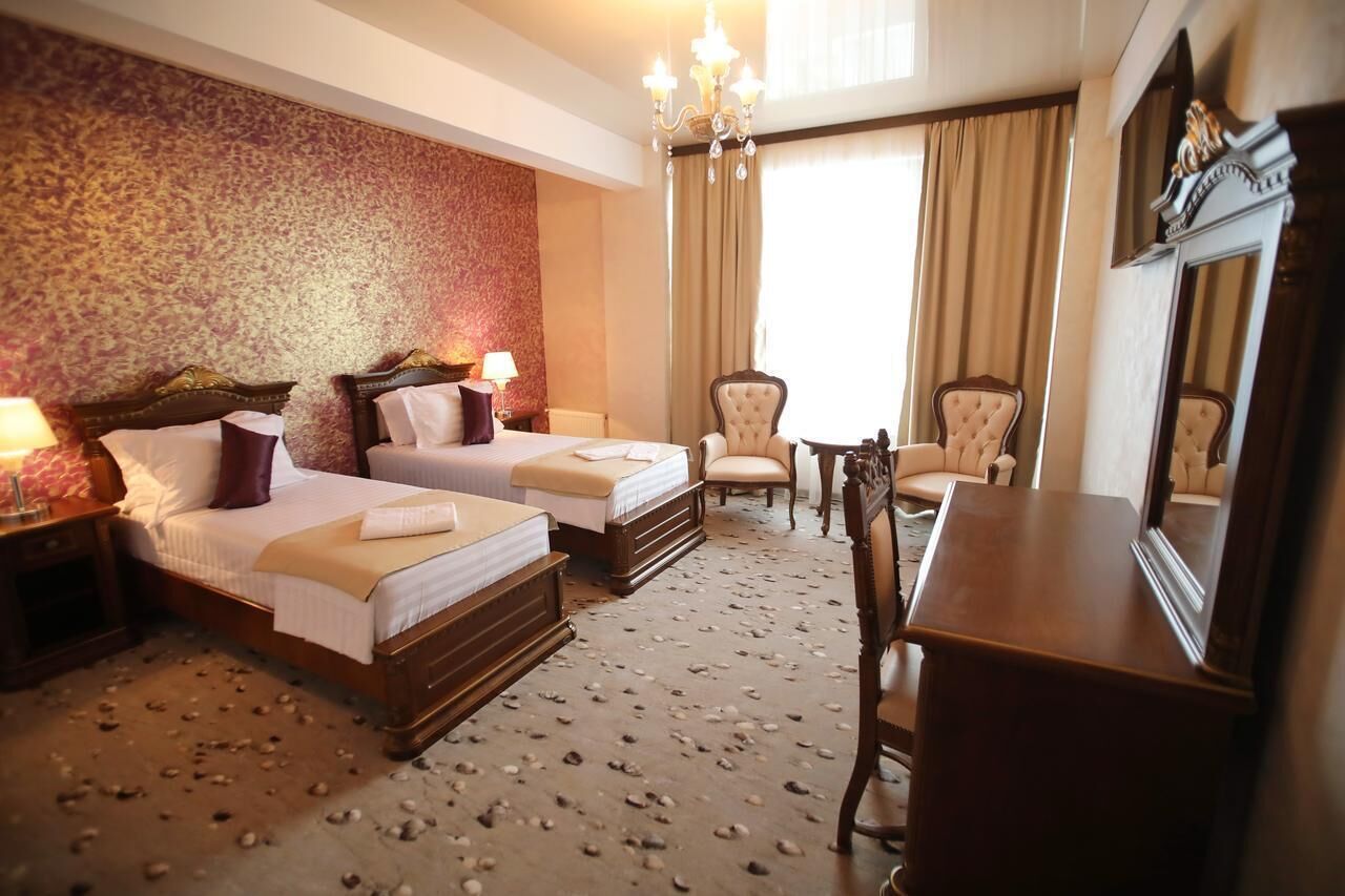 Deluxe Double or Twin Room, Balcony | In-room safe, desk, iron/ironing board, free WiFi