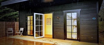 Black wooden house with annex near Stubbe Sø