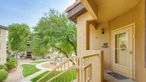 A residential building with a front entrance, a staircase, and a small garden area. - Resort-style Pools & Hot Tubs! Mtn-view Mesa Condo (Mesa)