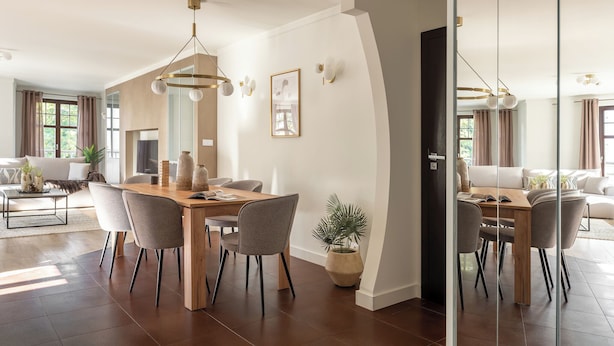 A modern dining area with a wooden table, chairs, and a hanging light fixture. - Sopot Haffnera - close to the beach  (Sopot)