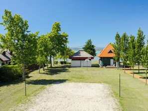 A residential area with houses, a basketball court, and a clear sky. - Vacation home Posha by Interhome (Balatonszemes)