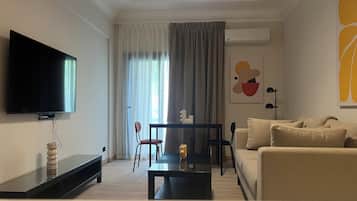 Deluxe Apartment, 1 Bedroom, Balcony, City View | Living area