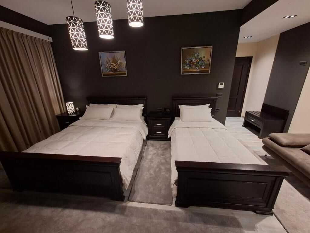 Deluxe Quadruple Room, Mountain View | Minibar, desk, soundproofing, free WiFi