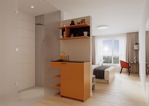 Ein modernes Zimmer mit integrierter Küche, einem Essbereich und einem großen Fenster mit Blick auf die Stadt.