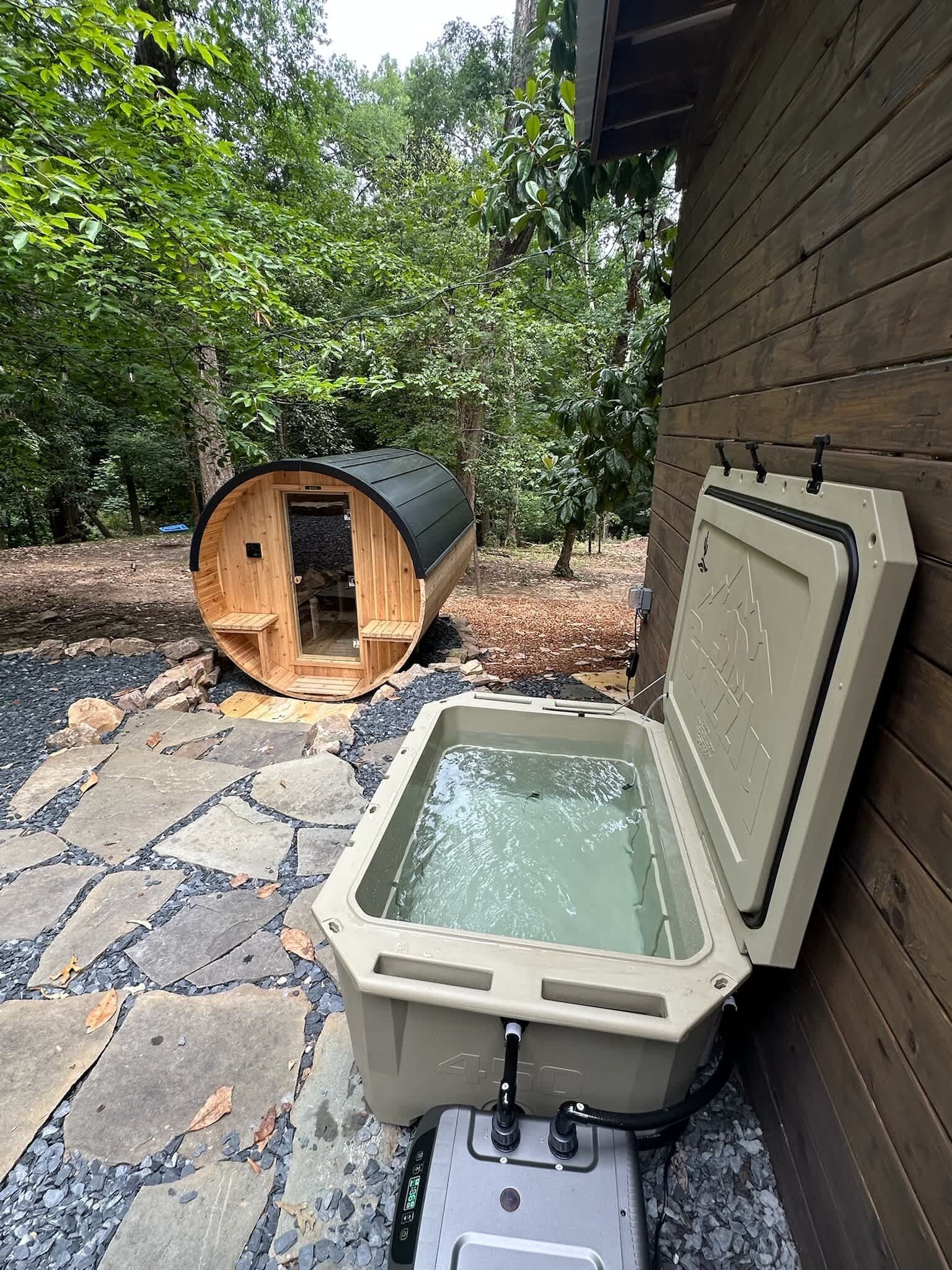 A hot tub with a wooden structure in the background.