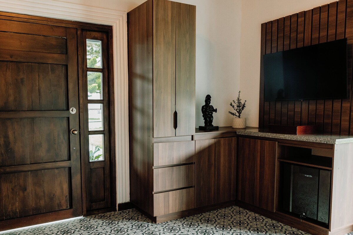 A kitchen with wooden cabinets, a built-in oven, and a tiled backsplash.