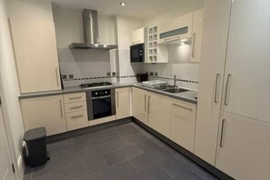 Private kitchen - Contemporary 1-Bed Apartment in The Bakery, Ormeau (Belfast)