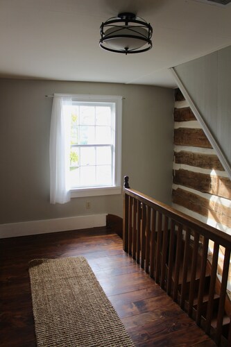 Historical 4-bedroom, 3-bathroom farmhouse comfortably sleeps up to 8 guests