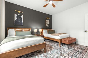 A hotel room with two beds, a ceiling fan, and a patterned rug. - Horse Country Escape 15 Minutes to WEC & Adventure Springs (Ocala)