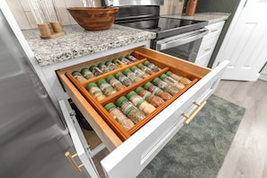 A kitchen drawer with multiple spice jars. - Horse Country Escape 15 Minutes to WEC & Adventure Springs (Ocala)