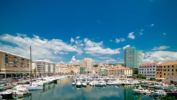 A marina with boats, buildings, and a clear sky. - [Sea Side] Beach 2 min • Free WiFi • Smart TV (Savona)