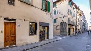 A street with buildings, a crosswalk, and pedestrians. - Geometric Design Suite by Maison Florence (Florence)