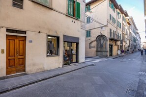 A street with buildings, a crosswalk, and pedestrians. - Geometric Design Suite by Maison Florence (Florence)