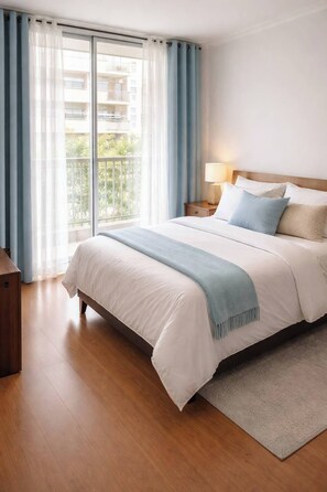 Tabla de planchar con plancha, internet y ropa de cama 