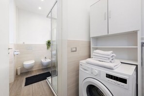 Shower, hair dryer, towels