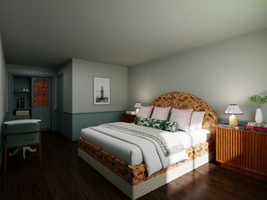 A bedroom with a bed, a nightstand, a lamp, a chair, and a small table.