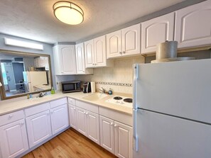Fridge, microwave, stovetop, coffee/tea maker