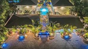 A resort with a central pool, multiple guest rooms, and a well-maintained garden. - Walk to Siesta Key Beach & Village | Pool | Dock | Game Room! (Siesta Key)