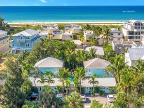 A coastal residential area with houses, a beach, and a clear view of the ocean. - New Listing - Dates Available Now!  Beach & Village | Pool | Dock | Game Room (Siesta Key)
