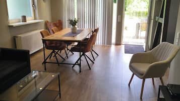 Apartment, Garden View | Living area | Table tennis, books