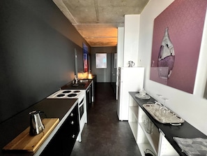 Huoneisto, 1 makuuhuone, patio | Yksityinen keittiö