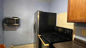 Room, 1 King Bed, Smoking, Kitchenette | Desk, iron/ironing board, free WiFi
