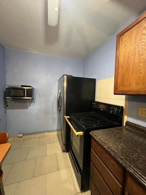 Room, 1 King Bed, Smoking, Kitchenette | Desk, iron/ironing board, free WiFi