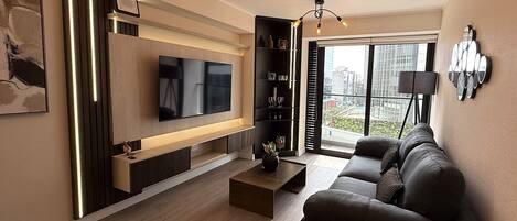 Superior Apartment, Balcony, City View | Living area | 55-inch Smart TV with cable channels