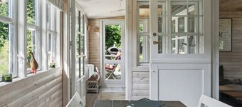 Wooden house with wild garden by Sejerø Bay