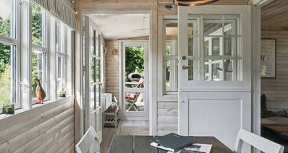 Wooden house with wild garden by Sejerø Bay