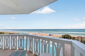 A balcony with a view of the beach and ocean. - VAN LEE BEACH CONDO 204!!!! (Ormond Beach)