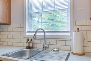 Fridge, microwave, oven, stovetop - The Calm Brick Retreat- Cozy Home w/ Deck & Yard (Winston-Salem)