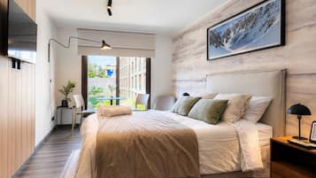 Premium bedding, down comforters, blackout drapes, iron/ironing board