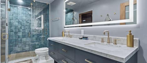 Shower, hair dryer, towels, shampoo