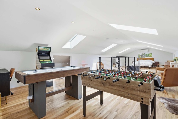 Upstairs Loft — Foosball, Air Hockey & Golden Tee Arcade with Skylights and Bedroom Beyond