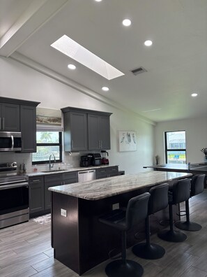Fridge, microwave, oven, stovetop - Pet friendly house with heated pool on Lotus Canal. (Cape Coral)