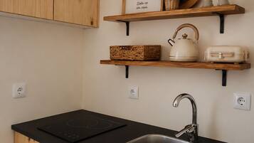 Fridge, microwave, stovetop, coffee/tea maker