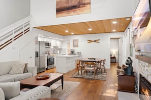 A modern living space with a kitchen, dining area, and a fireplace. - Incline Ski & Summer Fun! Walk to Beach, Pool & Hot Tub (Incline Village)