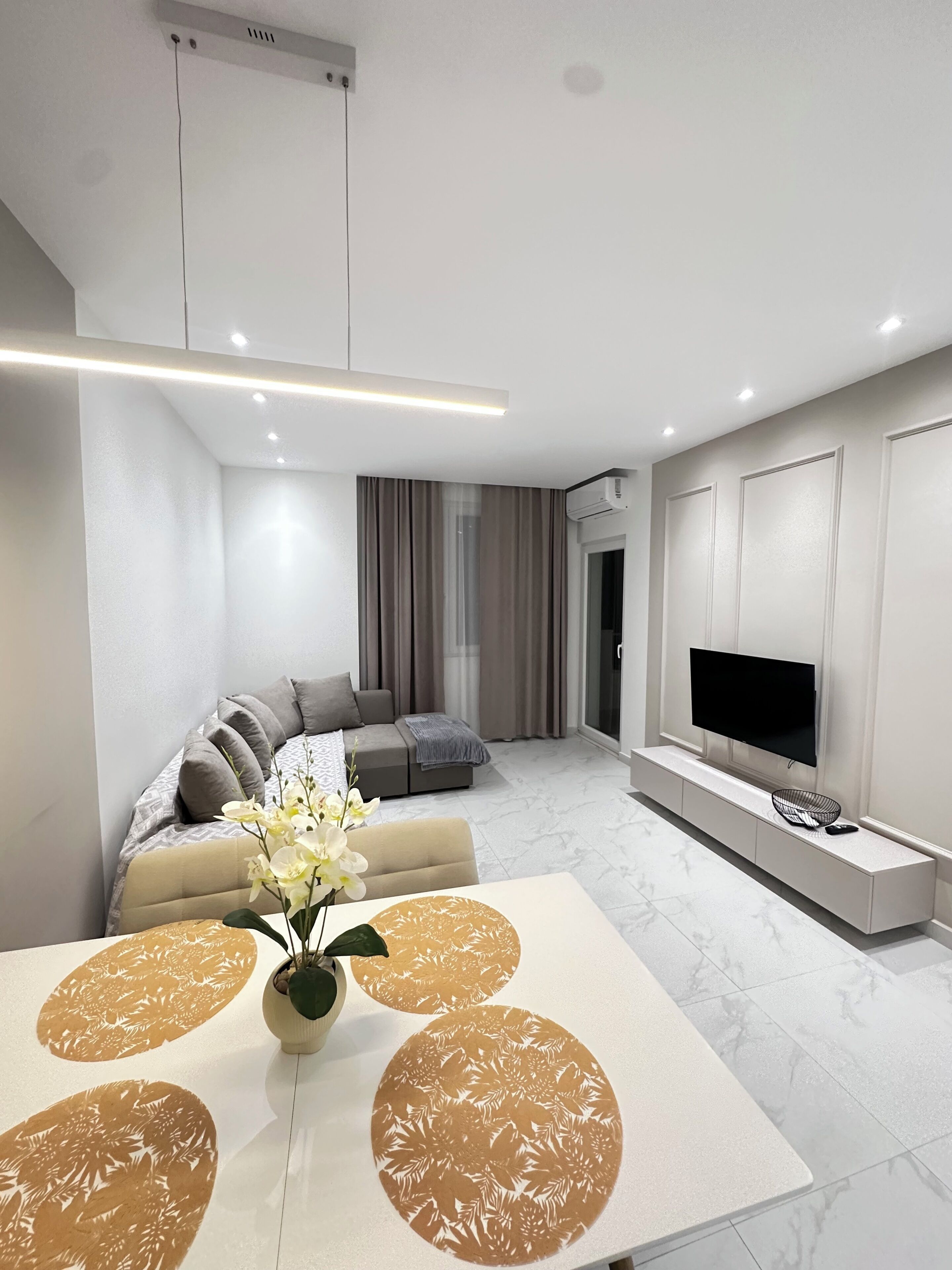 Family Apartment, Balcony | Living area | 100-cm Smart TV with digital channels